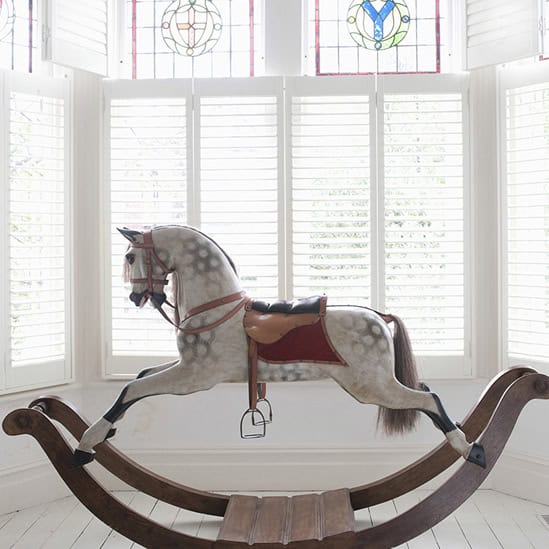 white shutters in bedroom